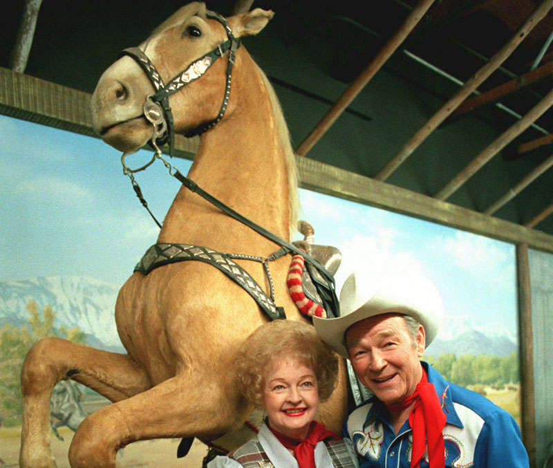 In this Feb. 15, 1984 file photo, Roy Rogers is shown with his wife Dale Evans before the stuffed remains of Trigger, Roy's horse, at the Roy Rogers museum in Victorville, Calif. An upcoming New York auction will feature Rogers belongings including the preserved remains of his famous horse, Trigger. The presale estimate for the dead horse is $100,000 to $200,000.