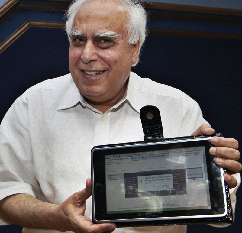 India's Human Resource Development Minister Kapil Sibal displays a basic touch-screen tablet aimed at students, which it hopes to bring into production by 2011. The device looks like an iPad and is 1/14th the cost.