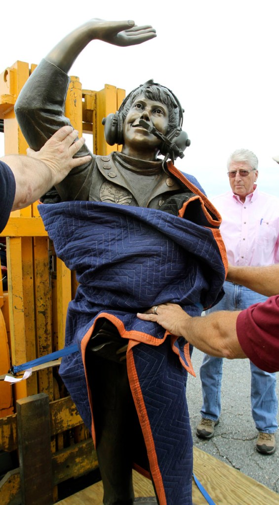 A bronze statue of the late Vicki Van Meter is delivered to the Augusta State Airport today. Her father, Jim Van Meter of St. George, Utah, watches in the background.