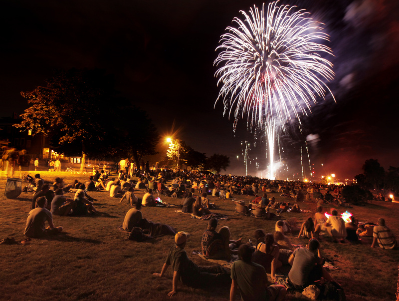 Spectators watch Portland's Fourth of July fireworks at the Eastern Prom on Sunday.