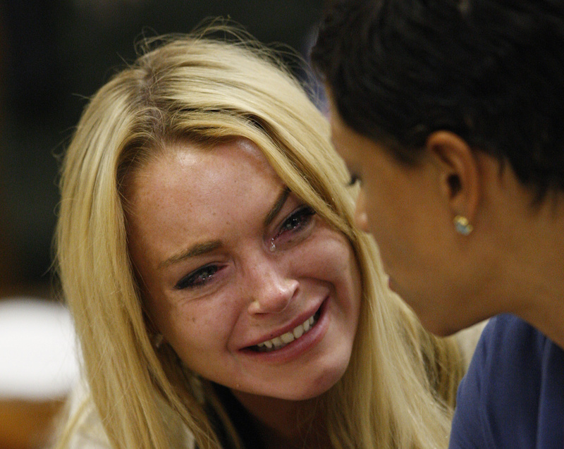 Actress Lindsay Lohan cries at a hearing in Beverly Hills, Calif., on Tuesday, where she was sentenced to 90 days in jail and a rehab program for violating terms of her probation.
