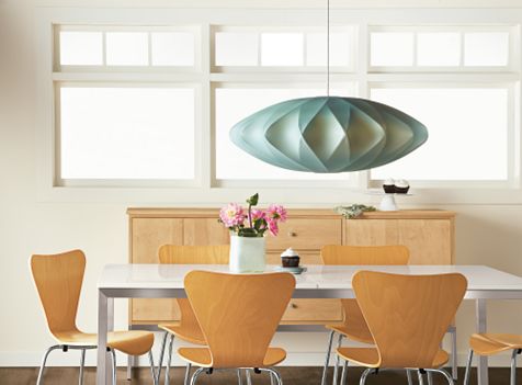 “Vintage lighting (such as this George Nelson pendant from the mid-20th century) is fantastic,” says interior designer Betsy Burnham, but old lampshades should be replaced with fresh ones to “enhance your vintage stuff, make it beautiful again.”