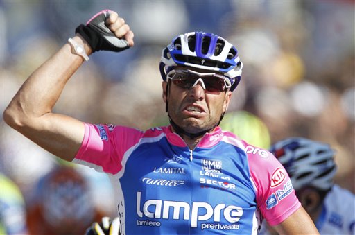 Alessandro Petacchi of Italy crosses the finish line to win the first stage of the Tour de France cycling race over 223,5 kilometers (139 miles) with start in Rotterdam, Netherlands and finish in Brussels, Belgium, Sunday July 4, 2010. (AP Photo/Laurent Rebours)