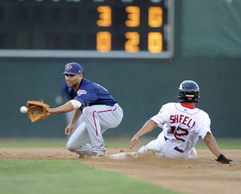 Matt Sheely of the Portland Sea Dogs steals second base in the third inning Wednesday night as Harrisburg shortstop Danny Espinosa takes the throw in Portland’s 7-4 victory.