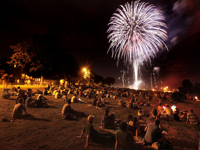Revelers spread out along the Eastern Prom in Portland on Sunday to listen to the Portland Symphony Orchestra and to see Portland’s fireworks display. A group of businesspeople paid for the display this year after the city cut funding.