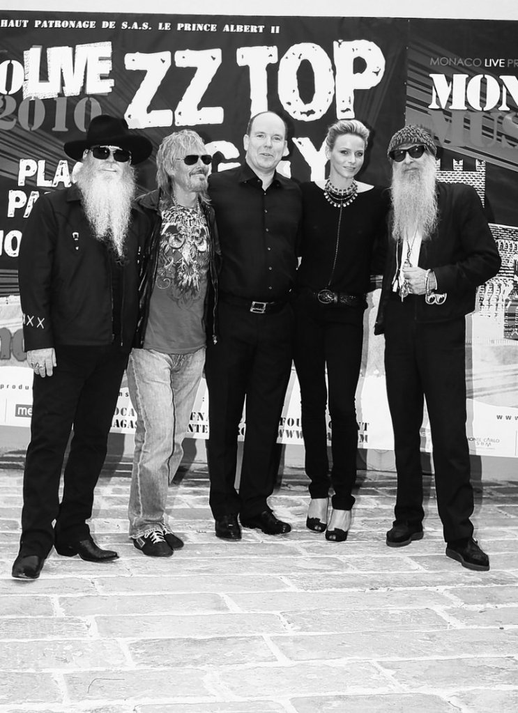 American blues rock trio ZZ Top pose with Prince Albert II of Monaco, center, and his fiancee, Charlene Wittstock, before giving an open-air concert Monday in Monaco.