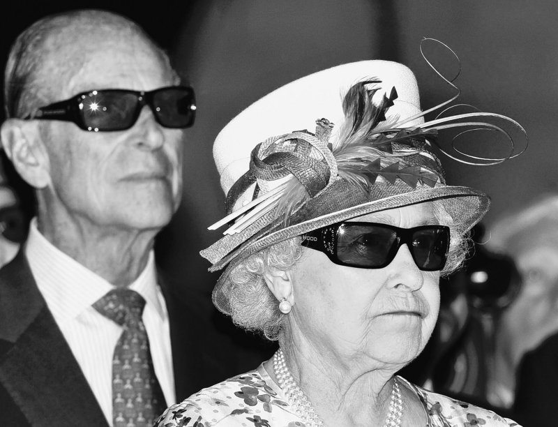 Britain’s Queen Elizabeth II and Prince Philip wear 3D glasses to watch a 3-D film at the Pinewood Studios in Toronto, Canada, on Monday.