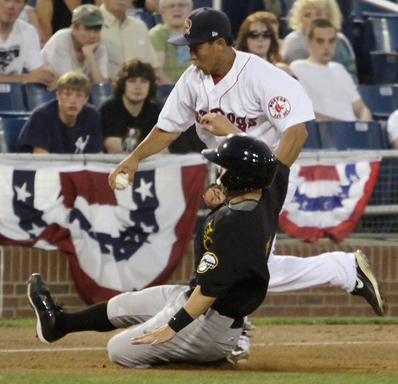 Portland third baseman Ray Chang races to the bag to try to force out New Hampshire’s Jonathan Diaz in the sixth inning at Hadlock. Diaz was safe and scored in the inning.