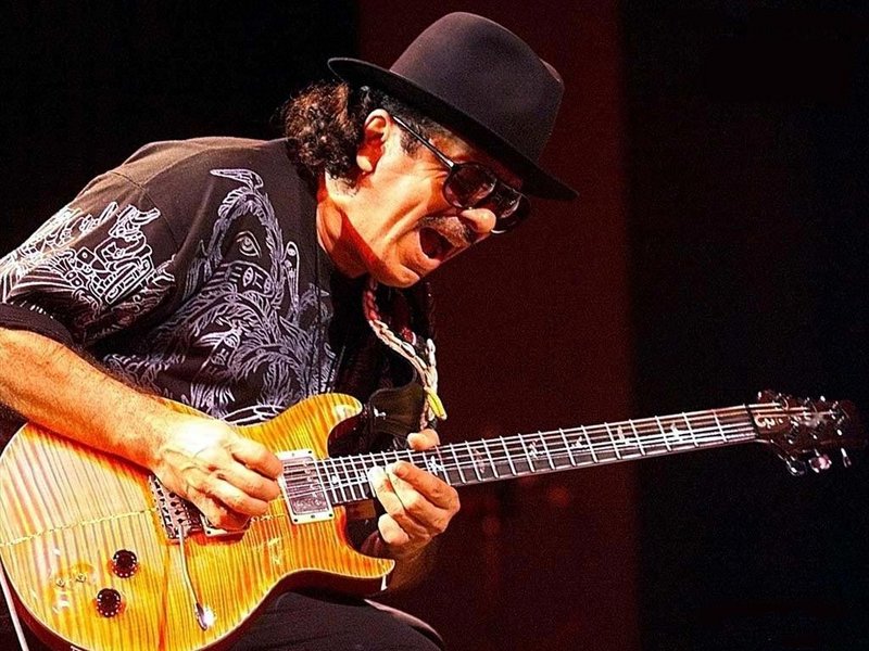 Carlos Santana performs with Steve Winwood on July 23 in Mansfield, Mass.