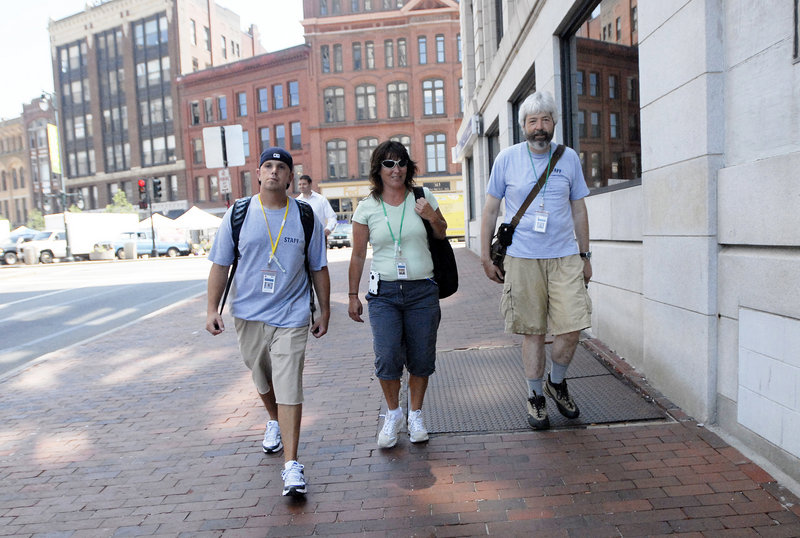 From left, Jesse Flynn, Peggy Lynch and John Dana, part of the new Homeless Outreach & Mobile Engagement Team, walk along Preble Street in Portland on Wednesday. Their aim: Help the homeless and help the city.