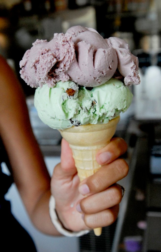 A pistachio and black raspberry ice cream cone is served at Garside's.