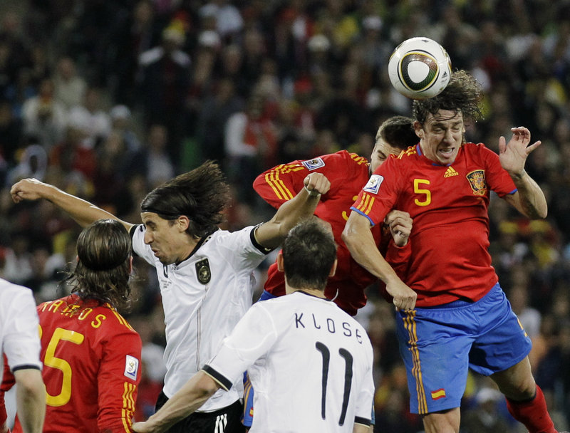 Carles Puyol of Spain thunders in to score on a corner kick Wednesday and give his team a 1-0 win over Germany.