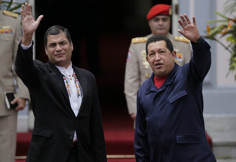 Rafael Correa, left, and Hugo Chavez