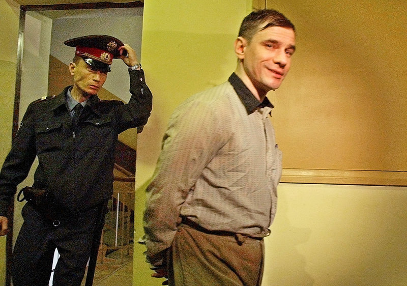 Igor Sutyagin, a Russian jailed for allegedly spying for the U.S., is escorted in 2002 to a Moscow courtroom. Sutyagin reportedly arrived in Vienna Thursday as part of the spy swap.