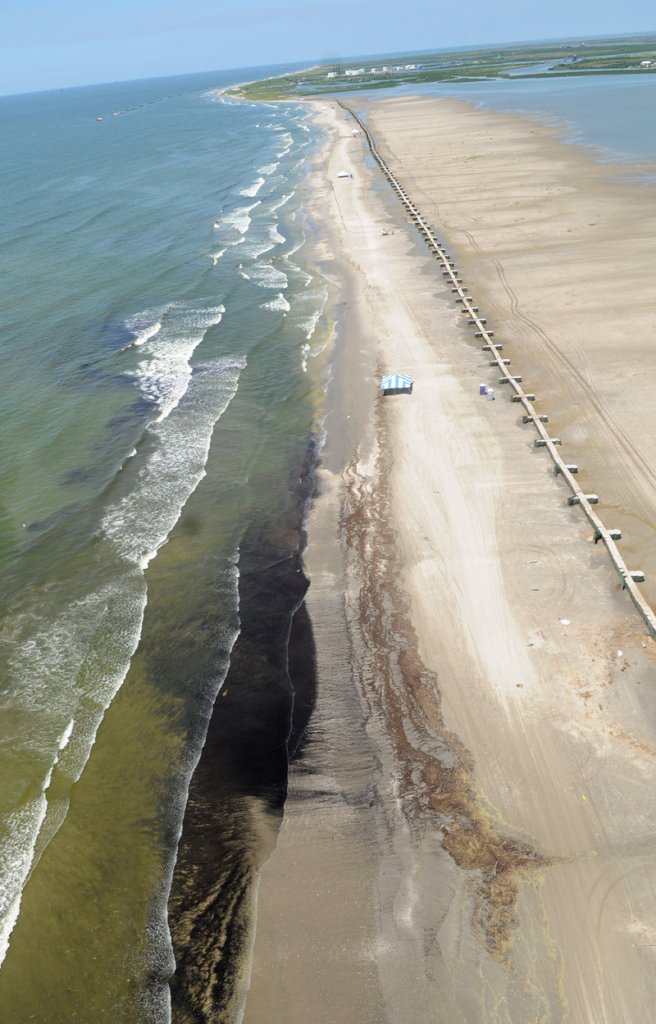 Crude oil from the Deepwater Horizon spill washes up onto Fourchon Beach, La., on Friday.