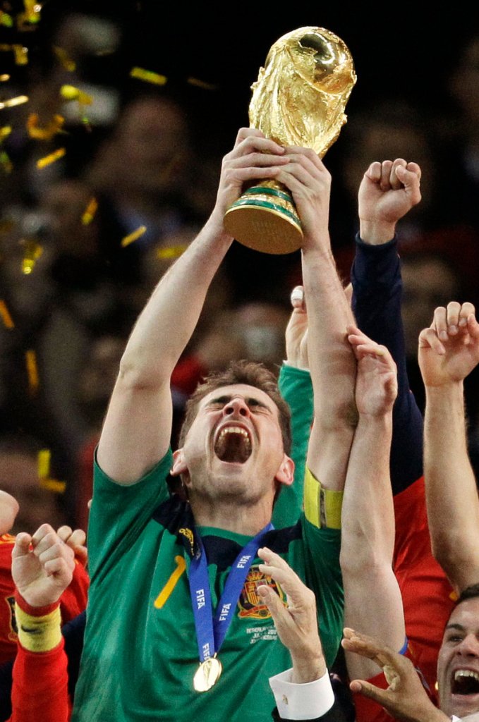 Goalkeeper Iker Casillas hoists the World Cup trophy Sunday night in a moment that Spain, with its long history of disappointing finishes in major tournaments, met with both relief and jubilation.