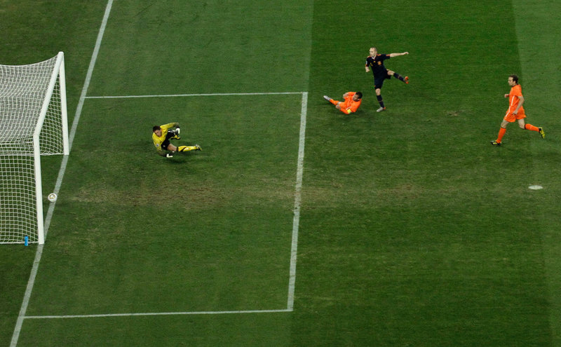 A shot by Andres Iniesta of Spain, second from right, crosses the goal line as Dutch keeper Maarten Stekelenburg watches late in extra time, sending Spain to its first World Cup title.