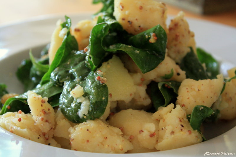 Potato spinach salad with lemon and mustard is an easy accompaniment to grilled fish and vegetables.