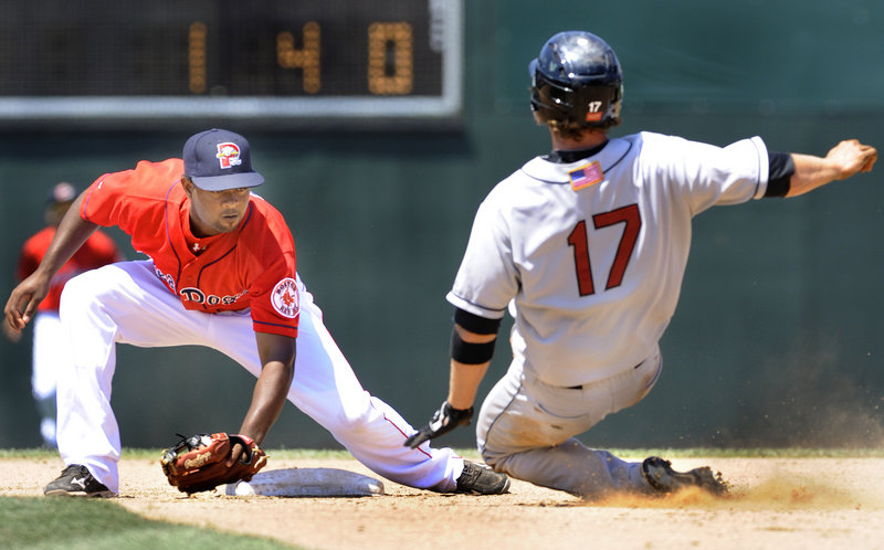 Joe Benson had a rough day on the bases for New Britain, this time being tagged out by Portland’s Yamaico Navarro on a steal attempt in the fifth inning Monday at Hadlock Field.