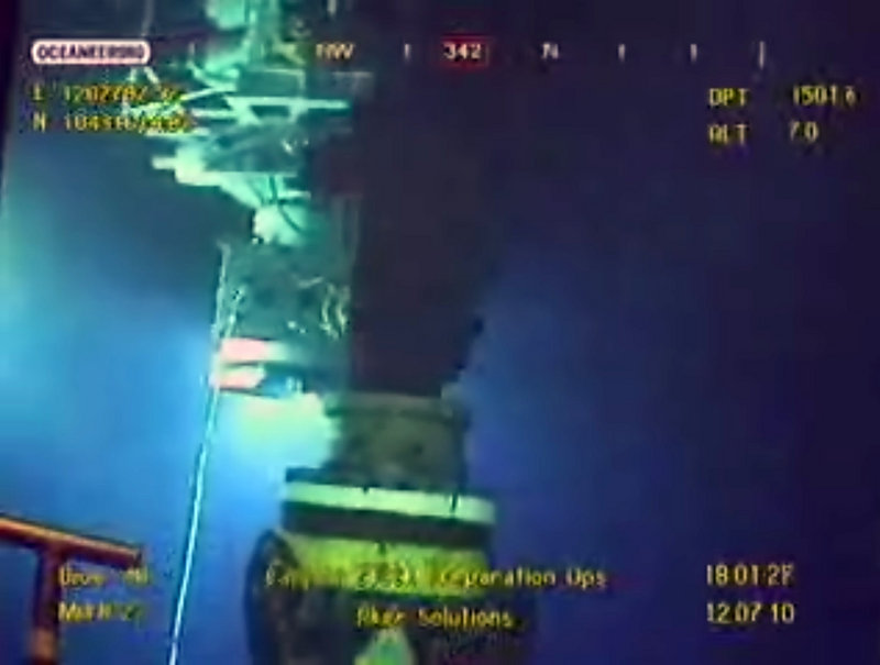 The Associated Press This is a two-line cut In LEFT PICis image taken from video provided by BP PLC at 18:01 CDT, oil flows from the broken well, center, as a new containment cap, left, hovers near the site of the Deepwater Horizon oil spill in the Gulf of Mexico, Monday, July 12, 2010. Deep-sea robots swarmed around BPs ruptured oil well Monday in a delicately choreographed effort to attach a tighter-fitting cap that could finally stop crude from gushing into the Gulf of Mexico nearly three months into the crisis RIGHT PICthis image taken from video provided by BP PLC at 18:17 CDT, a new containment cap, top, is lowered over the broken wellhead at the site of the Deepwater Horizon oil spill in the Gulf of Mexico, Monday, July 12, 2010. Deep-sea robots swarmed around BPs ruptured oil well Monday in a delicately choreographed effort to attach the tighter-fitting cap that could finally stop crude from gushing into the Gulf of Mexico nearly three months into the crisis. (AP Photo/BP PLC) NO SALES