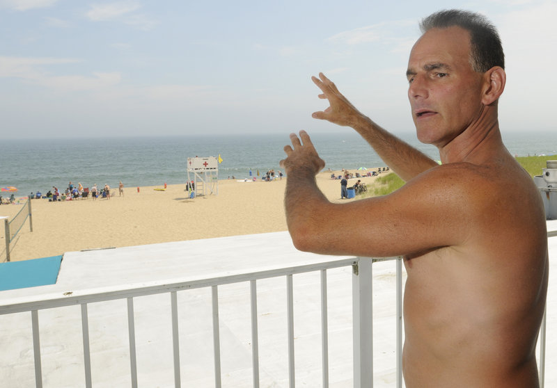 Dan Mahoney of Worcester, Mass., was body boarding Monday at Old Orchard Beach when he was caught in a riptide. Cresting waves finally brought him back to shore.