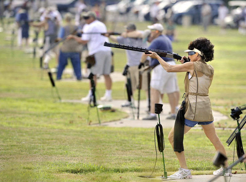 Barbara Wyman, foreground, of Gorham takes her shots Thursday during the opening day of the four-day Maine State Trapshoot at the Scarborough Fish & Game Club at 70 Holmes Road.