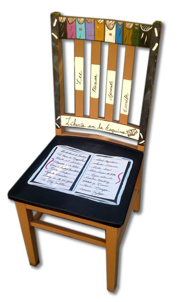 This chair is titled "Libreria en la Esquina," translated to "Corner Bookstore." The chair honors Chicana writers in the "book" on the seat.