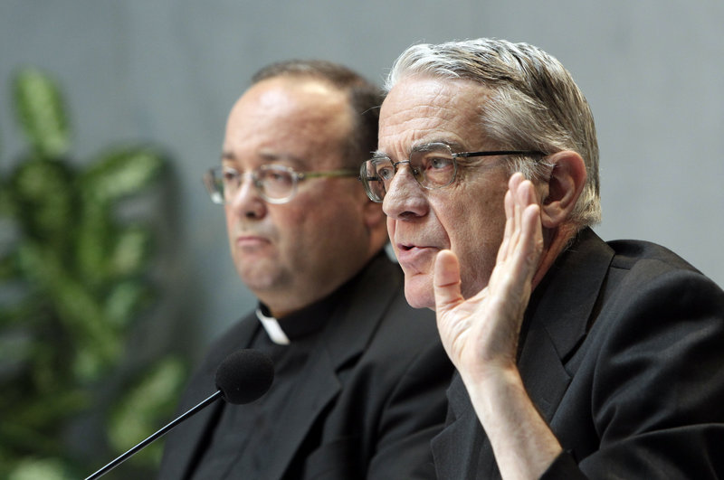 Vatican spokesman the Rev. Federico Lombardi, right, and Monsignor Charles Scicluna talk to the media Thursday.