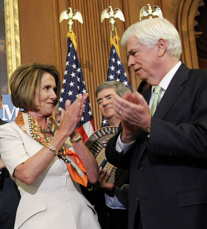 House Speaker Nancy Pelosi, D-Calif., applauds with Sen. Christopher Dodd, D-Conn., after signing the financial reform legislation bill during a ceremony on Capitol Hill Thursday.