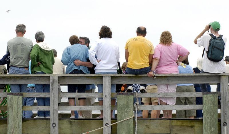 Spectators line the Searsport town dock to watch the race. Competitors, helped by family and friends, raced on a three-quarter mile drag strip.