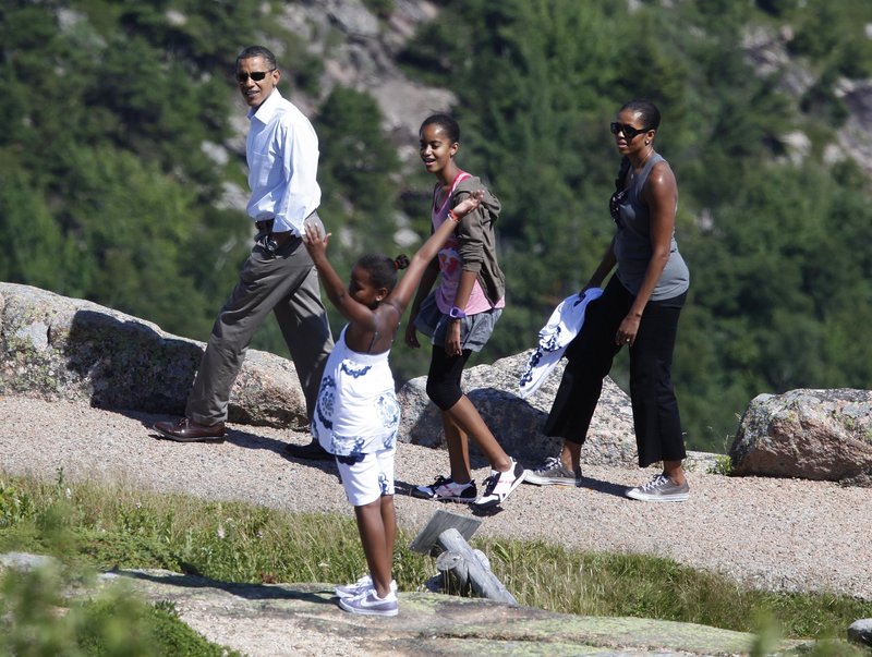 President Obama, first lady Michelle Obama, and daughters Malia, back, and Sasha visit Cadillac Mountain in Acadia National Park on Friday, the first day of their weekend getaway to Maine.