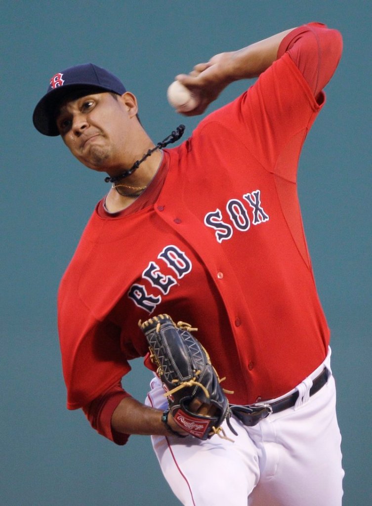 Felix Doubrount delivers a pitch against the Texas Rangers on Friday night at Fenway Park. The Rangers got to Doubrount early, scoring two runs in the first.