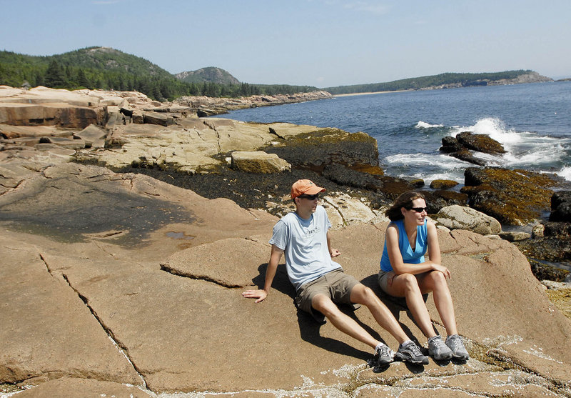 Ed and Cate Fitzgerald of Glens Falls, N.Y., take in the view from the rocky coast at Acadia National Park on Saturday. The Fitzgeralds found out on the way to Maine that their trip to the park would coincide with the visit of President Obama and his family.