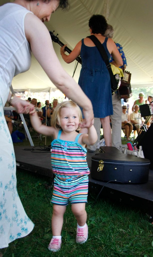Two-year-old Grace Mike of Arizona dances with a friend to the tunes of JimmyJo & the Jumbol’ayuhs.