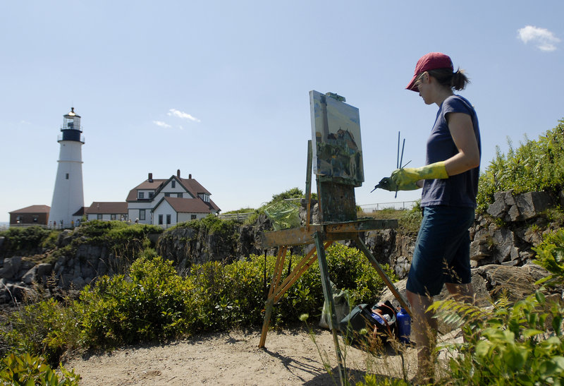 Emily Leonard Trenholm of Bangor paints Portland Head Light in Fort Williams Park for the Paint for Preservation 2010 3rd Annual Wet Paint Auction Sunday.