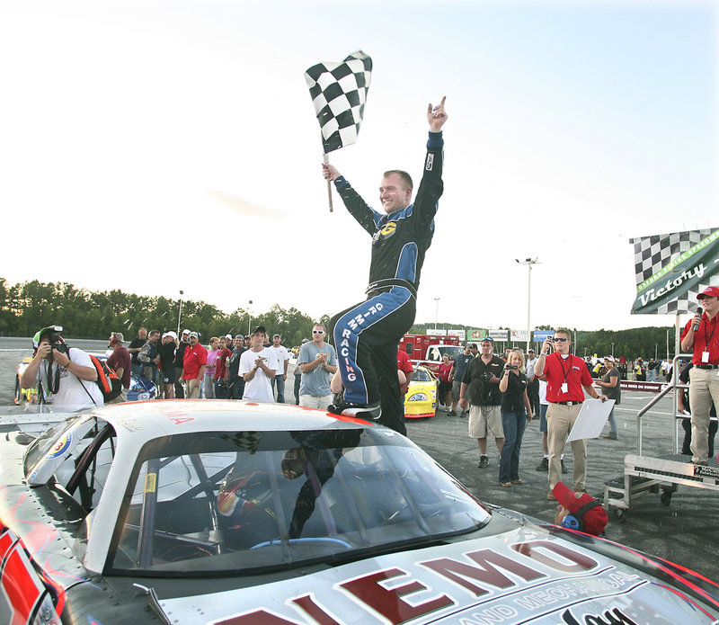 Eddie MacDonald celebrates his second consecutive victory in the TD Bank 250 on Sunday at Oxford Plains Speedway. It was MacDonald's fourth straight win at the track.