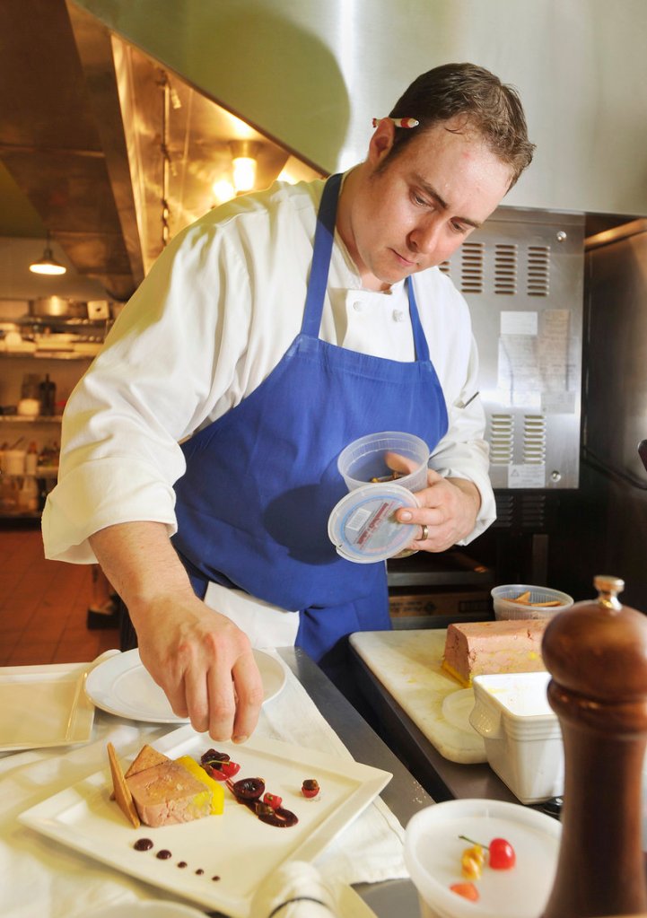 Jacob Jasinski, chef at the Salt Exchange in Portland, prepares a new dish for his restaurant's menu, Hudson Valley foie gras terrine with local cherries, pistachio and savory black pepper cookies. Jasinski likes to change the menu every few months.