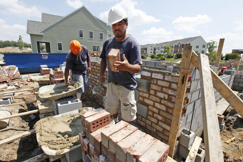 A mason lays brick on a foundation for a new home last week in Richmond, Va. Home construction plunged last month to the lowest level since October as the economy remained weak and demand for housing plummeted.