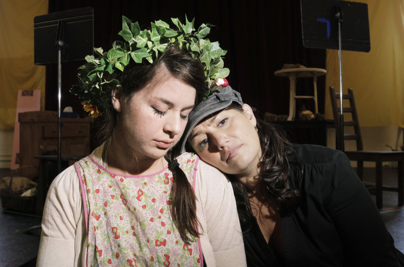 Angela Mortellaro as Gretel and Heather Johnson as Hansel rehearse a scene in which they drift off to sleep in PORTopera’s “Hansel and Gretel.” The opera will be performed at Merrill Auditorium on Thursday and Saturday.