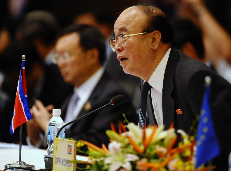North Korean Foreign Minister Pak Ui Chun sits down next to his Chinese counterpart, Yang Jiechi, as they attend the plenary session of the ASEAN Regional Forum in Hanoi, Vietnam, on Friday.