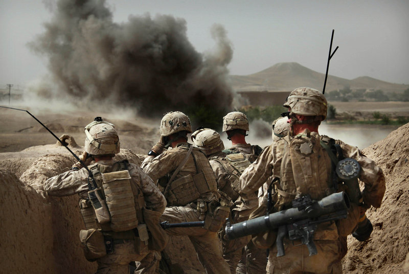 Marines from Bravo Company of the 1st Battalion, 2nd Marines, watch an explosion after calling in an airstrike as part of an operation to clear the area of insurgents near Musa Qaleh, in northern Helmand Province, southern Afghanistan, on Friday.