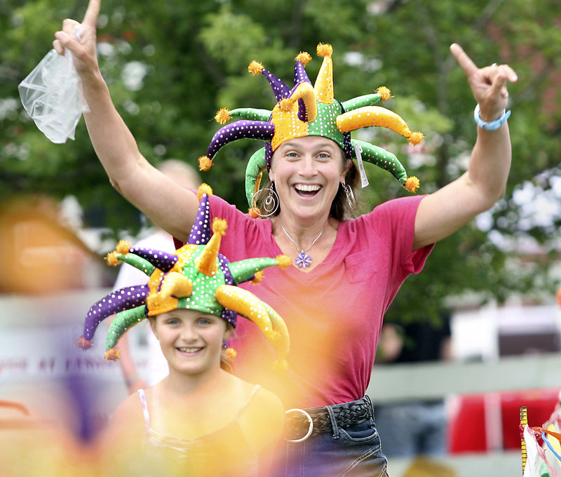 Andrea Kalkstein of Carlisle, Mass., celebrates with her daughter Suzanne after winning jester hats while competing in a three-legged race during Richmond Days on Saturday.