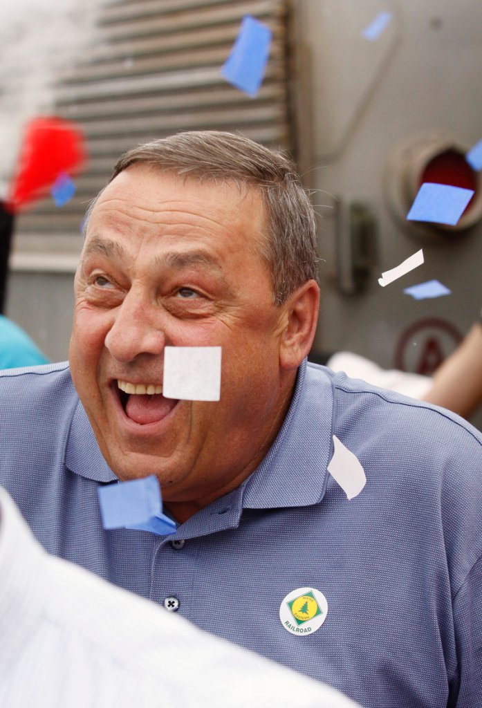 Confetti falls on Republican Paul LePage during a gubernatorial campaign stop in Bath.