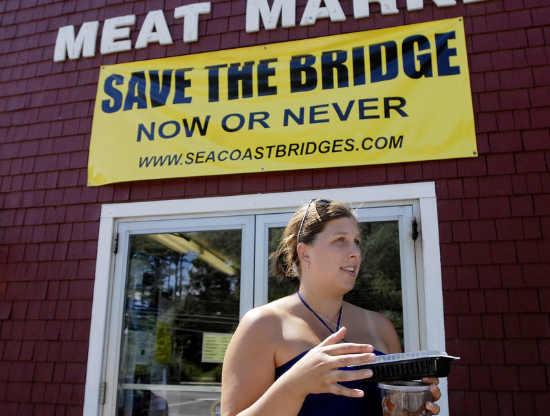 Sarah Caine of Kittery talks about Memorial Bridge after shopping at Carl's Meat Market in Kittery, where a Save the Bridge sign is on display.