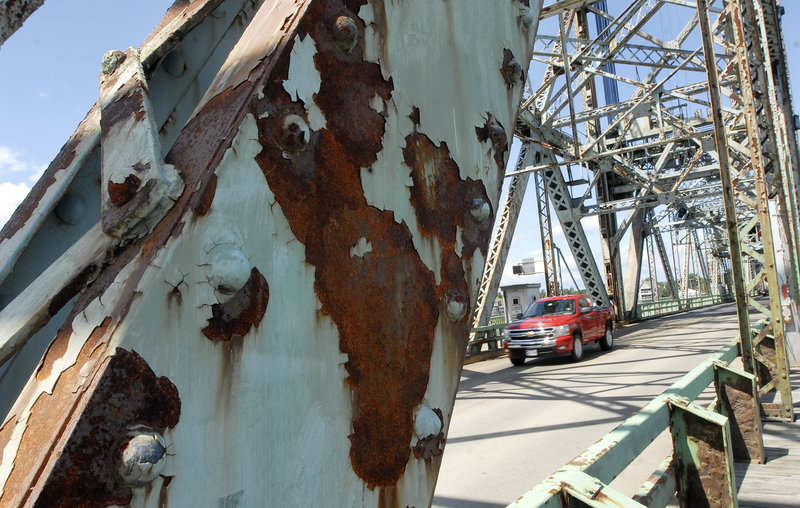A truck crosses the rusty Memorial Bridge that links Portsmouth, N.H., and Kittery. While a citizens group is pressing for keeping open both the Memorial and the Sarah Mildred Long bridges, Maine Gov. John Baldacci is reserving judgment until a study is complete.