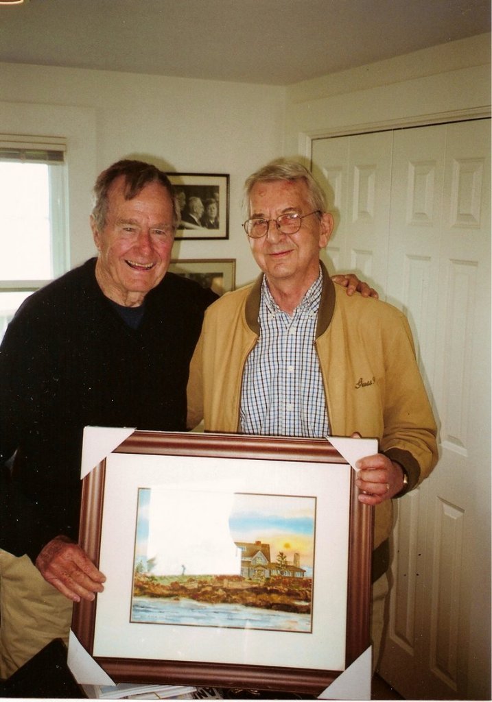 Former President George H.W. Bush poses with Dick Anzelc and one of his paintings of Walker's Point in Kennebunkport.