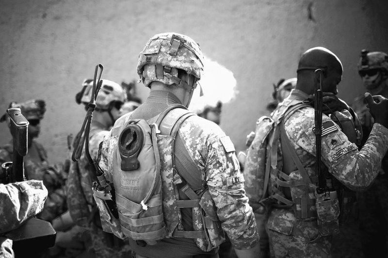 U.S. soldiers with the 101st Airborne Division prepare for a patrol near Combat Outpost Nolen, in the volatile Arghandab Valley near Kandahar, Afghanistan, on Monday. Afghans seem little surprised over information posted by WikiLeaks, although President Hamid Karzai was “shocked” at the number of documents leaked, a spokesman said.