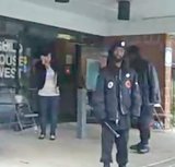 New Black Panther Party members Samir Shabazz and Jerry Jackson hold clubs outside a Philadelphia polling place on Nov. 4, 2008, in a video shot by a passer-by.