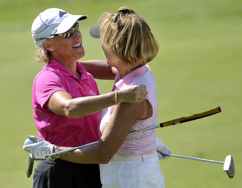 Kristin Kannegieser, left, and Debby Gardner share a hug after Kannegieser held off Gardner in the final round Wednesday for a victory in the WMSGA championship.