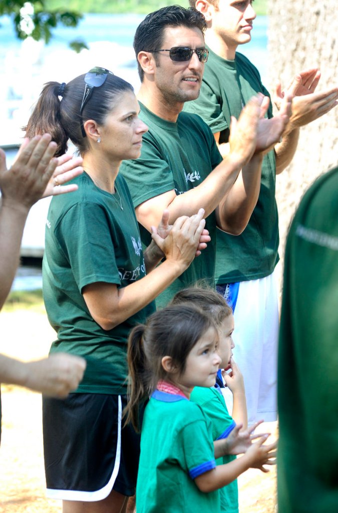 Mia Hamm stands with her husband, former Red Sox shortstop Nomar Garciaparra, and their twin 3-year-old girls, Ava and Grace, during Thursday’s visit.